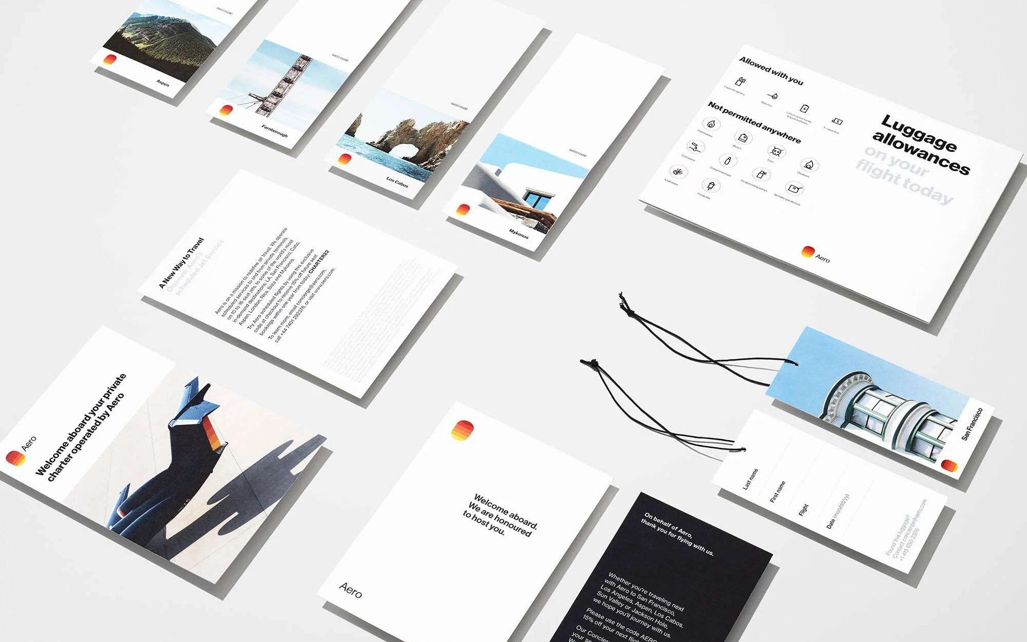 Collection of printed marketing materials, including luggage tags and promotional flyers, arranged on a clean white surface.