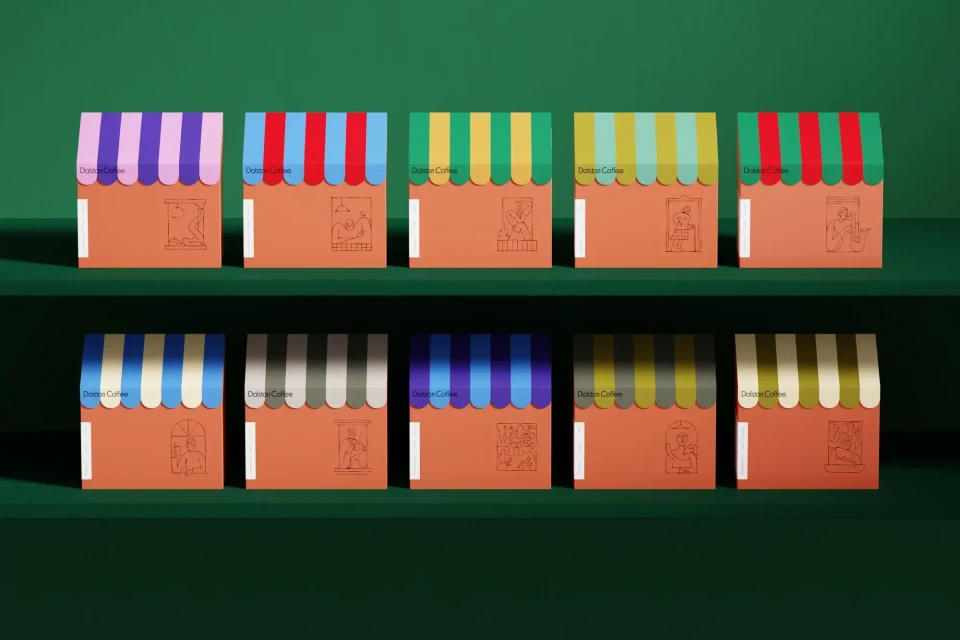 Colorful stylized coffee packaging designed to look like storefronts, arranged on a two-tier green shelf, studio product shot.