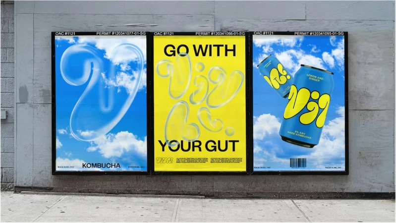 Outdoor advertising features three posters side-by-side: abstract cloud design, yellow Vizi text, and Vizi beverage cans against a sky backdrop.