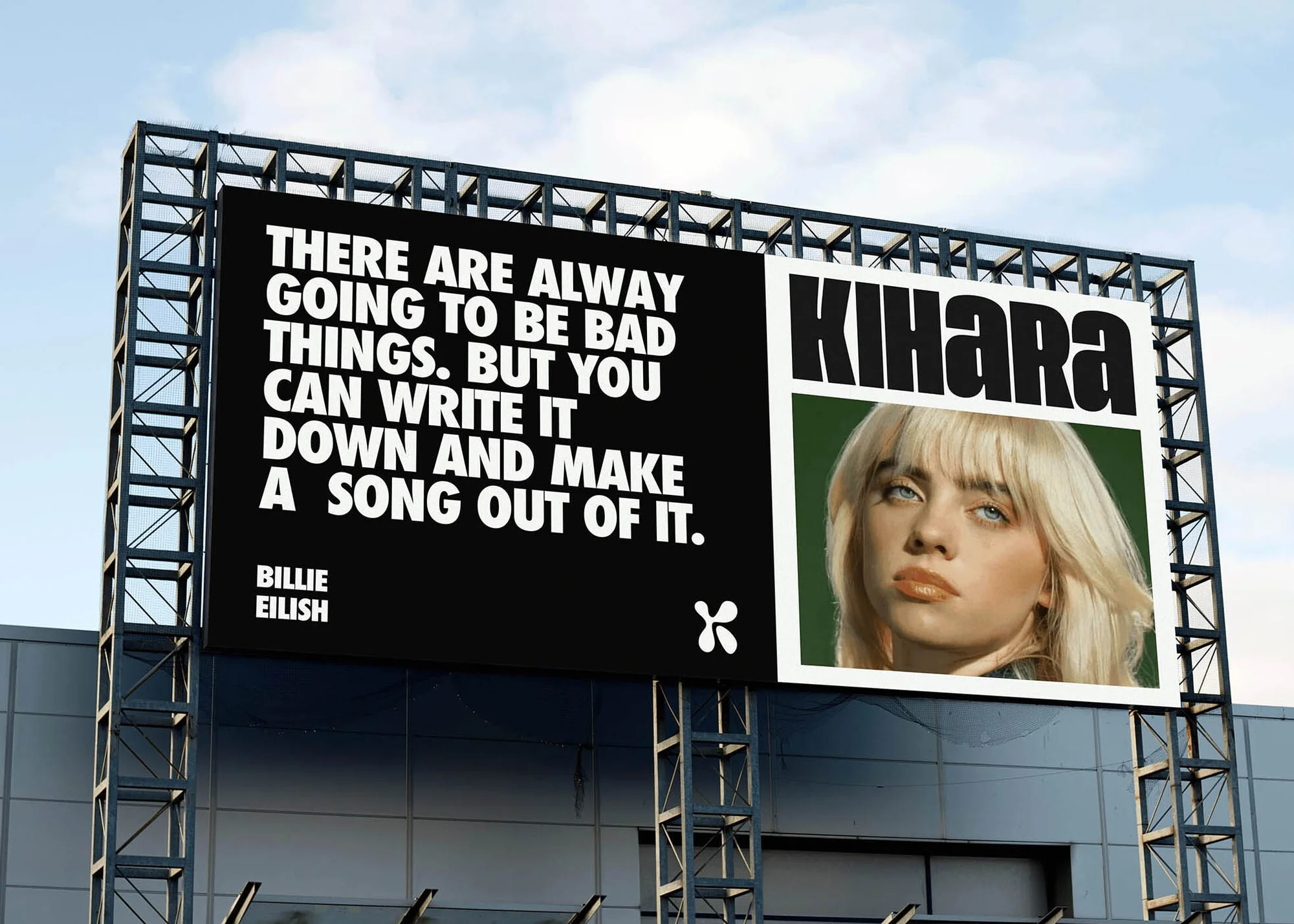 Outdoor billboard featuring an advertisement for Kihara with a Billie Eilish portrait and a quote, set against a blue sky backdrop.