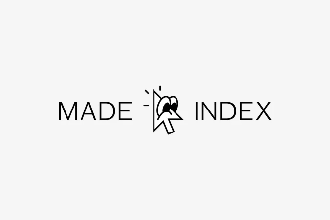 Logo featuring stylized cartoon mouse pointer with eyes, placed between the words MADE and INDEX on a plain white background.