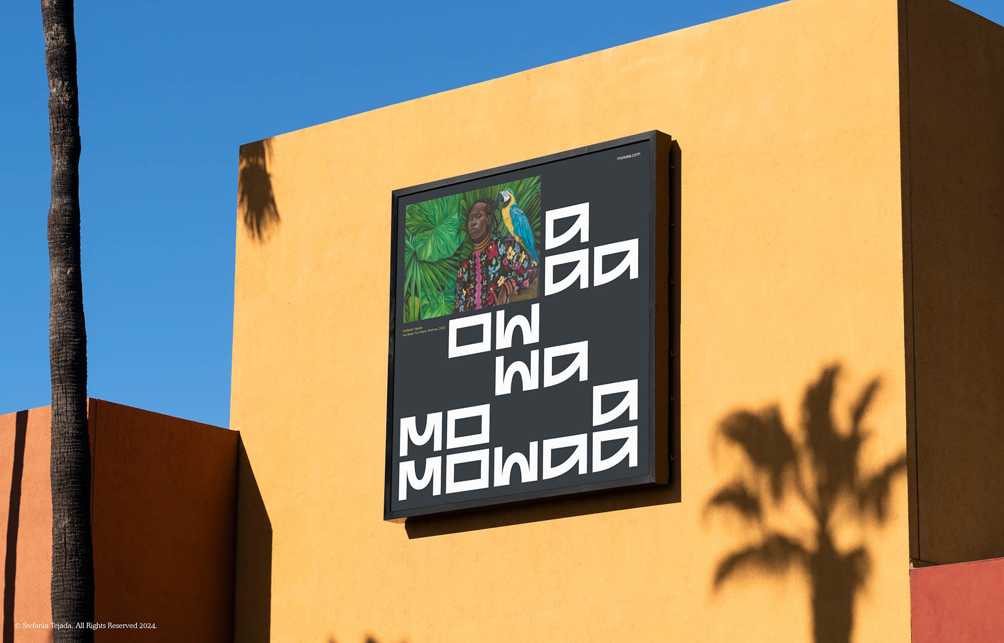 Artwork on a yellow wall features a woman and a parrot, accented by bold typography and shadows from a palm tree in the background.