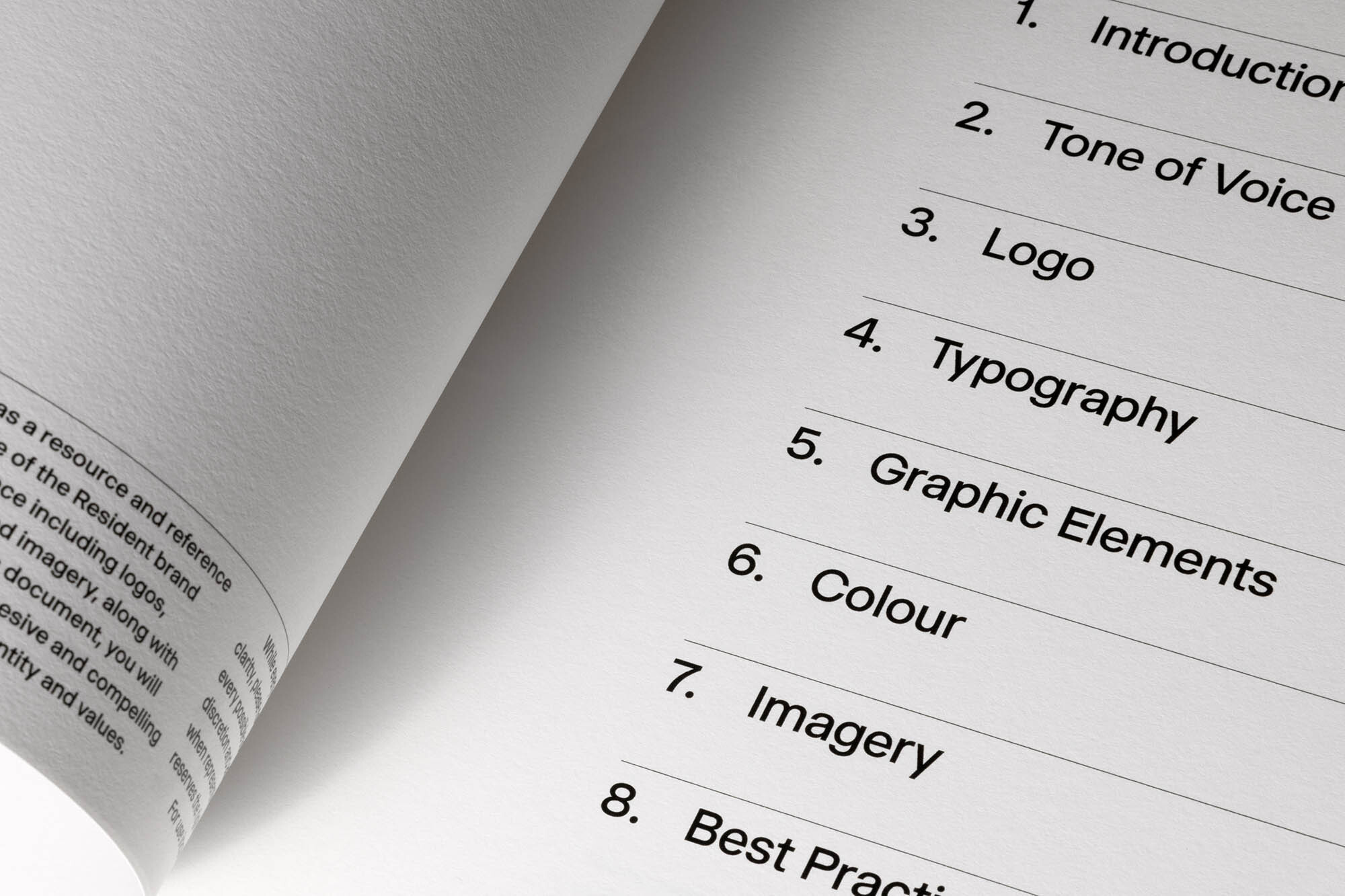Open book displays table of contents: Introduction, Tone of Voice, Logo, Typography, Graphic Elements, Colour, Imagery, Best Practice.