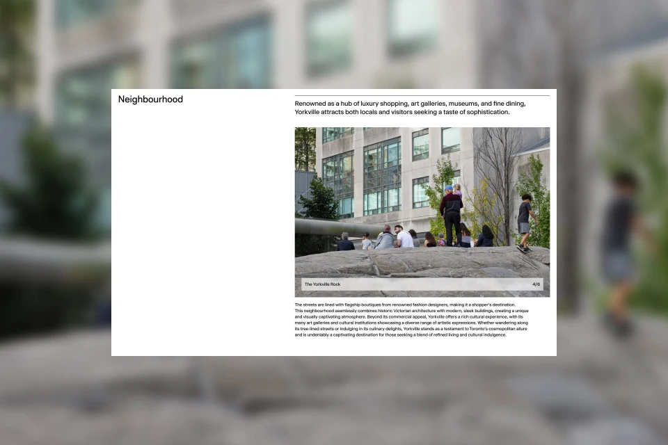 Outdoor scene featuring a group of people relaxing on a rock formation in an urban environment, with modern architecture in the background.