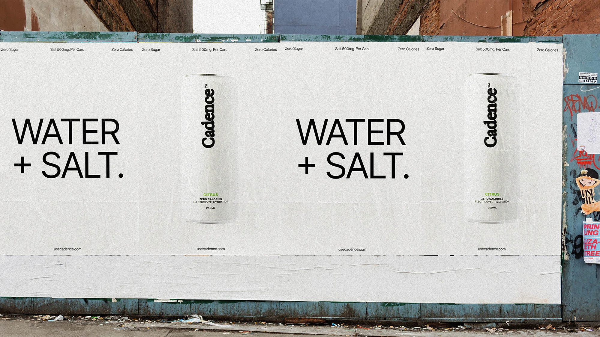 Outdoor advertising billboard featuring two 'Cadence' drink cans with 'Water + Salt' text, set against an urban brick and concrete wall.