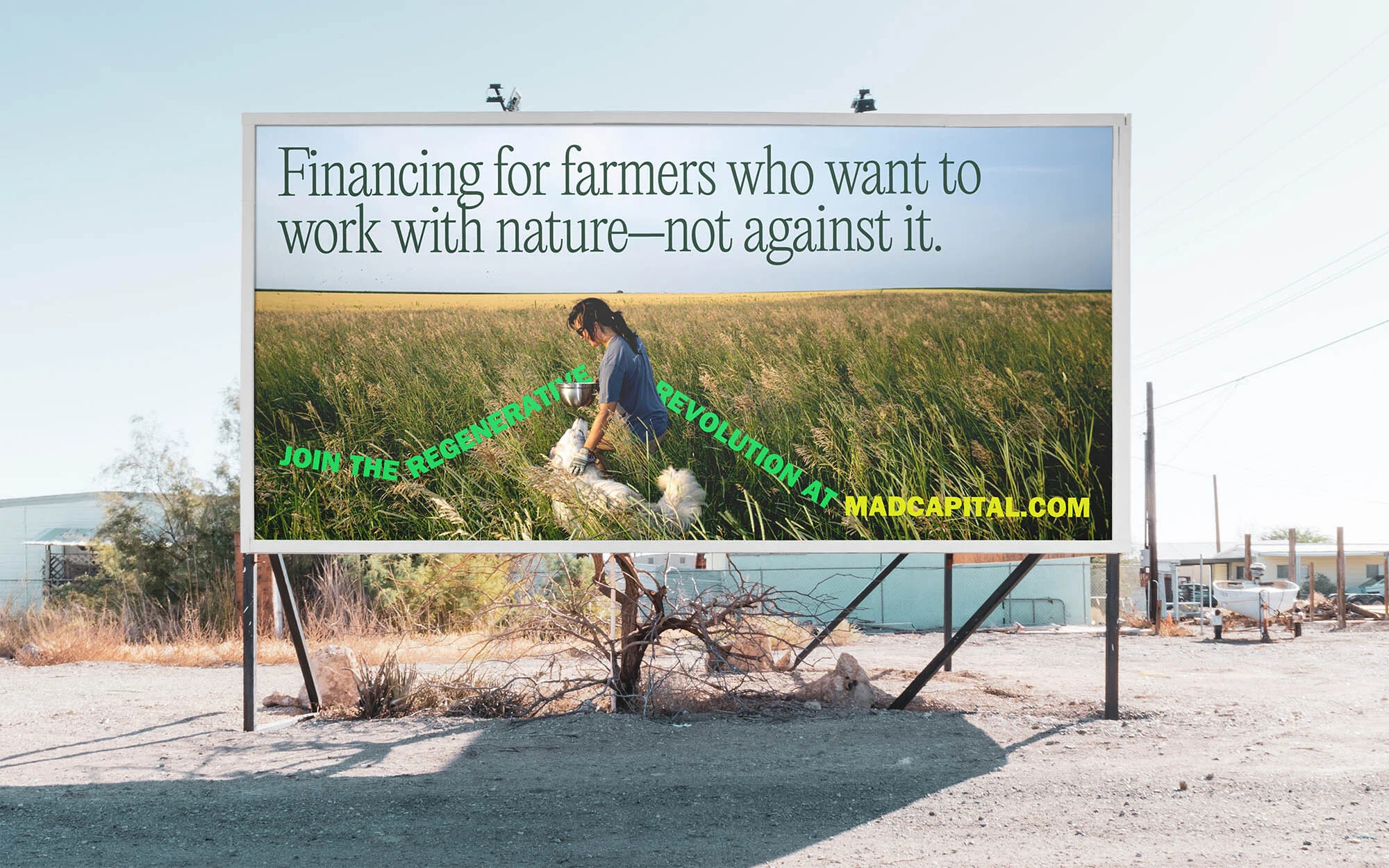 Billboard advertisement featuring a woman working in a field, promoting financing for farmers in harmony with nature at MADCAPITAL.com.