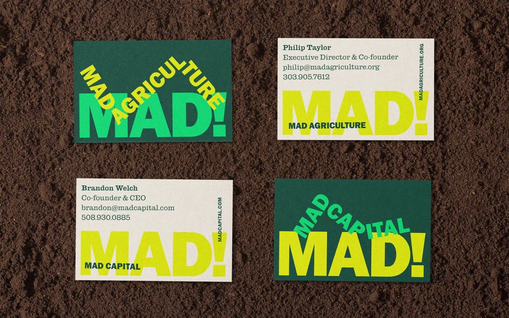 Four business cards with the company name 'MAD' on a brown background with the names and titles of Philip Taylor and Brandon Welch.