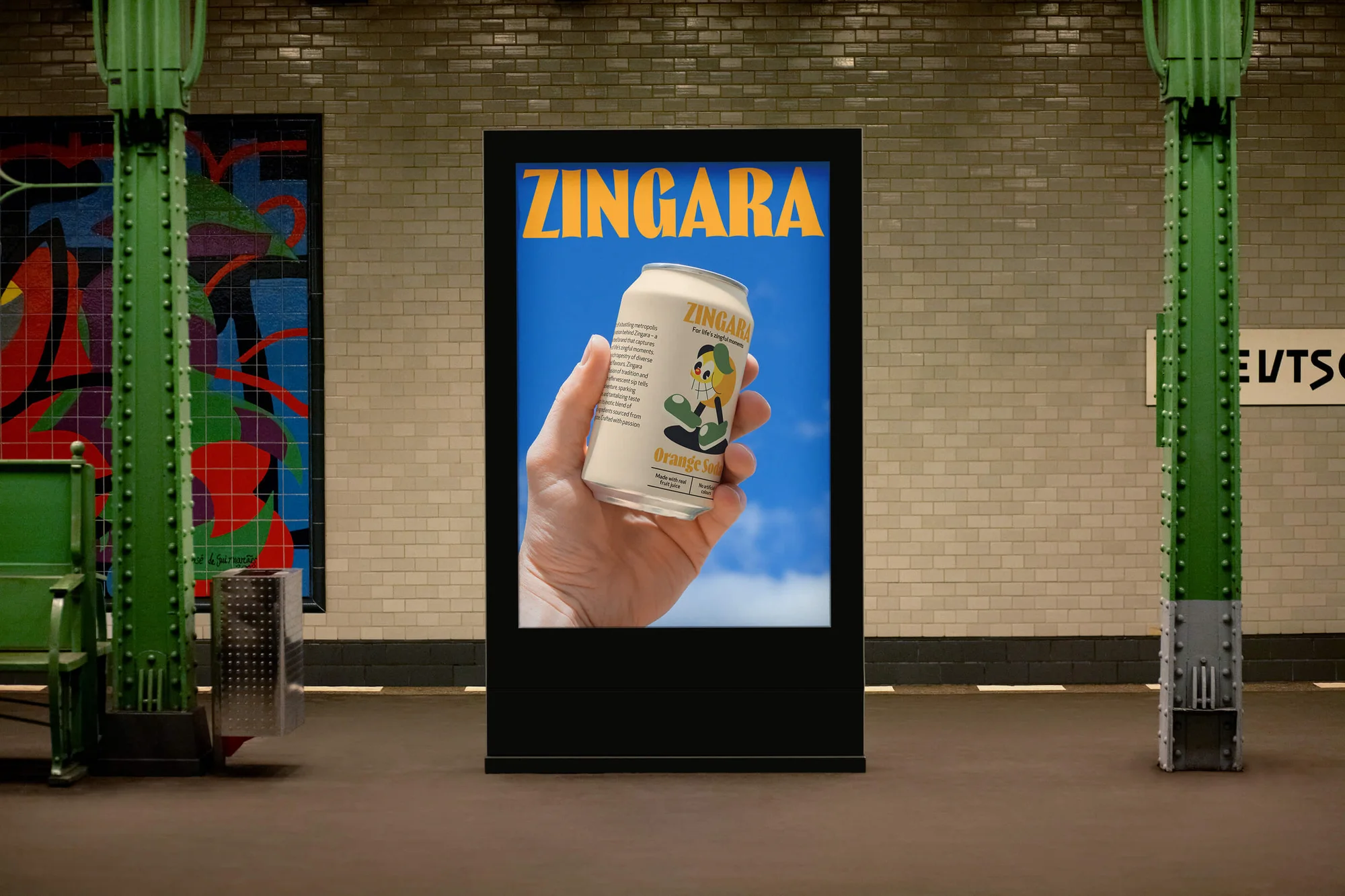 Advertising poster in a subway featuring a hand holding a can of orange soda, promoting the Zingara brand in a public transportation setting.