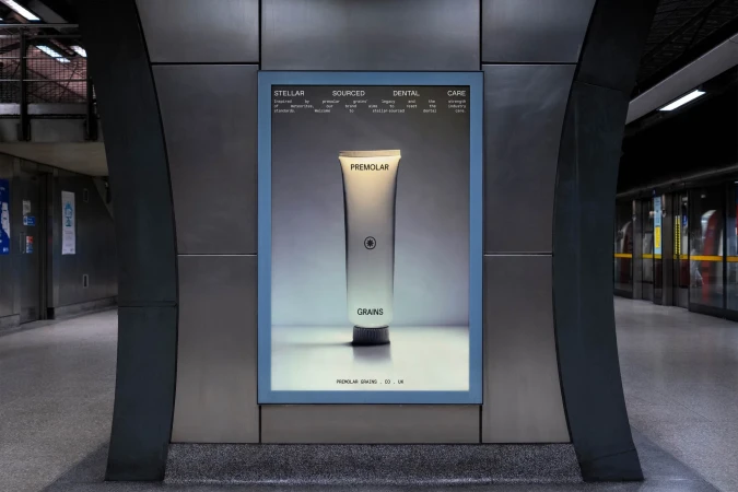 Advertising display in a subway station featuring a tooth-paste tube with the brand name Premolar in grayscale tones with blue frame.