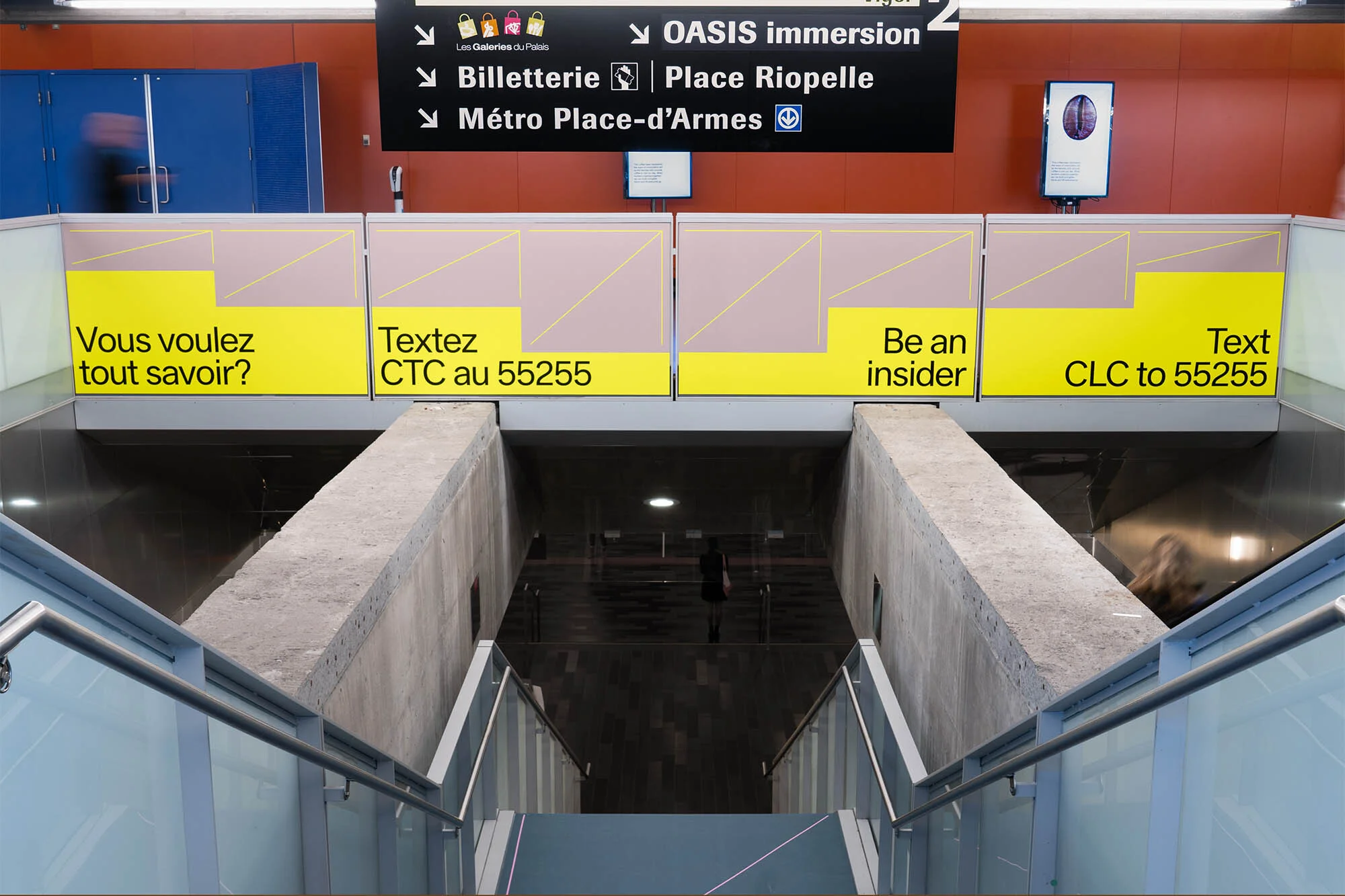 Subway station stairway with advertising banners and directional signs, leading to underground platform, urban transit scene.