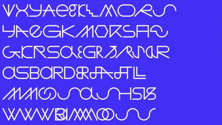White custom typographic characters and graphic lettering displayed on a vibrant blue background by Warriors Studio.