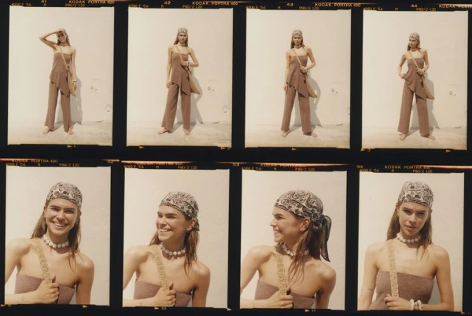 Fashion shot showcases a young woman in a matching set and headscarf, posing against a neutral background, captured through film photography.