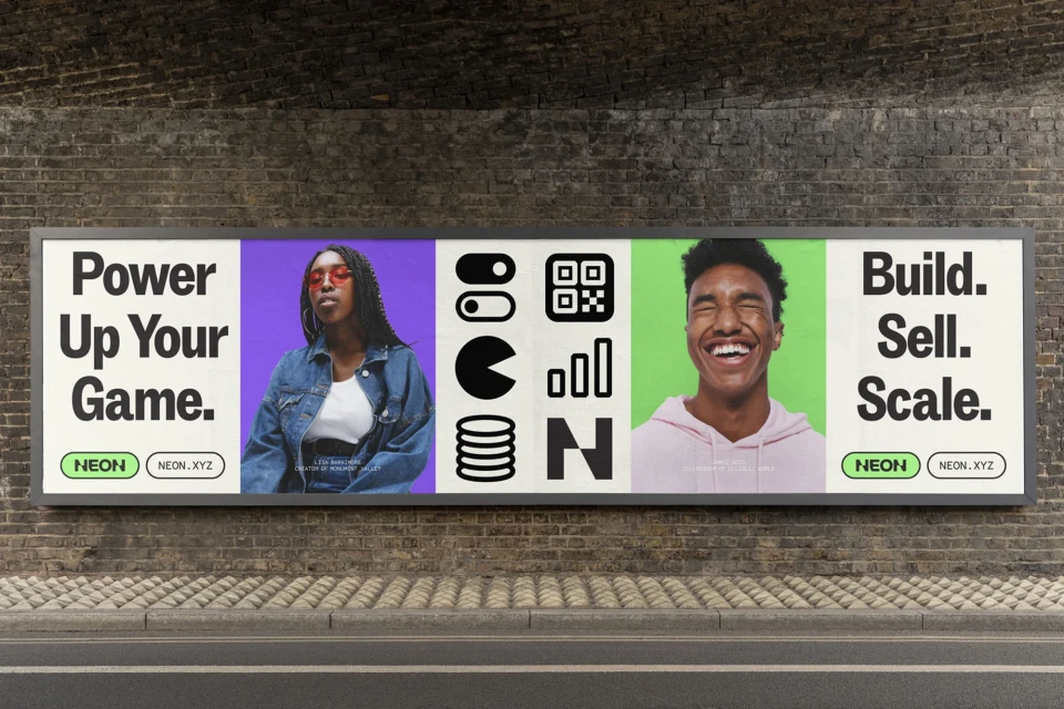 A digitally-altered billboard displays a young woman with sunglasses, digital icons, and a smiling young man promoting a product.