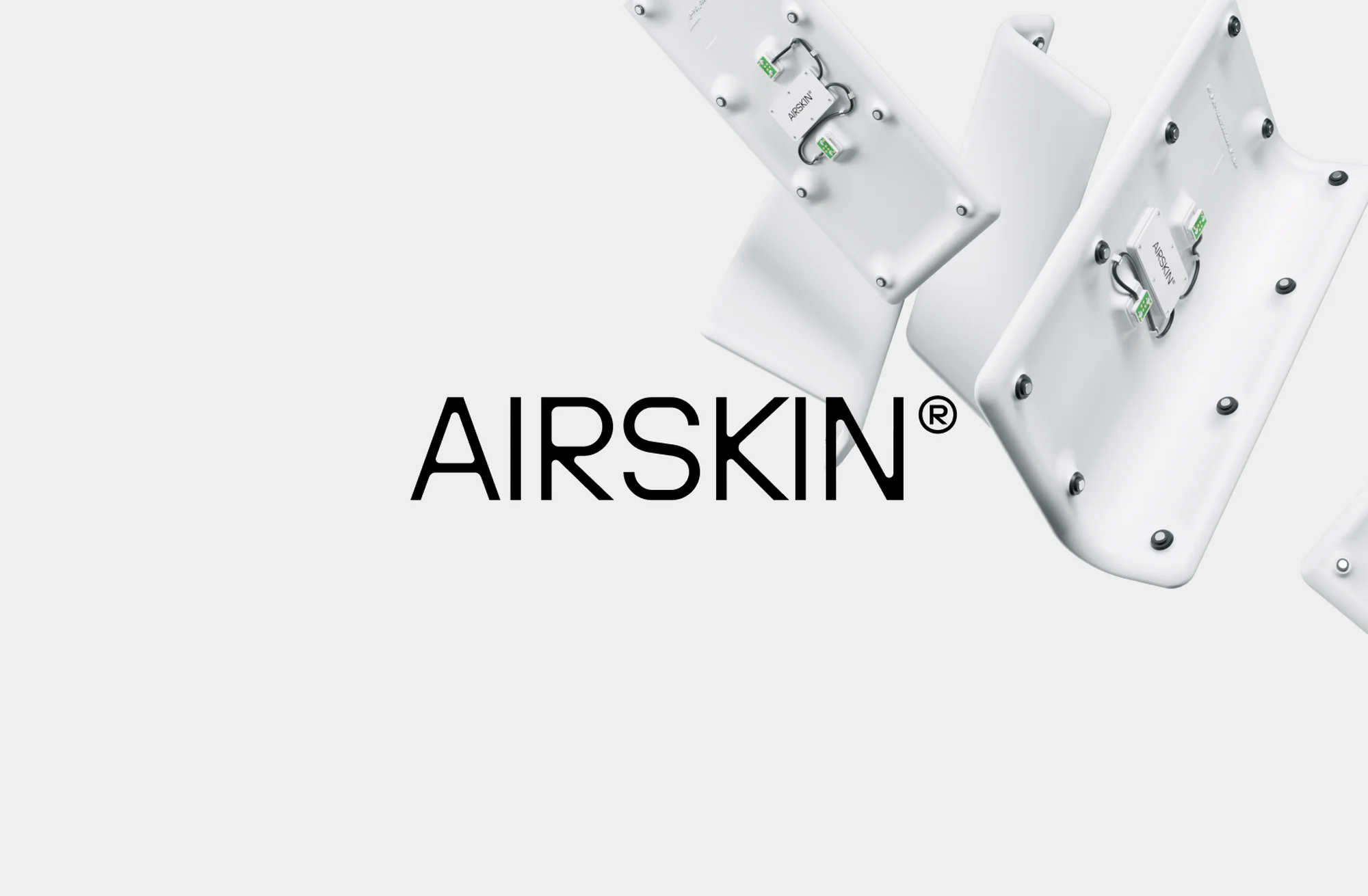 Product shot showcasing AIRSKIN® technology with white components and visible circuitry against a neutral backdrop with brand typography.