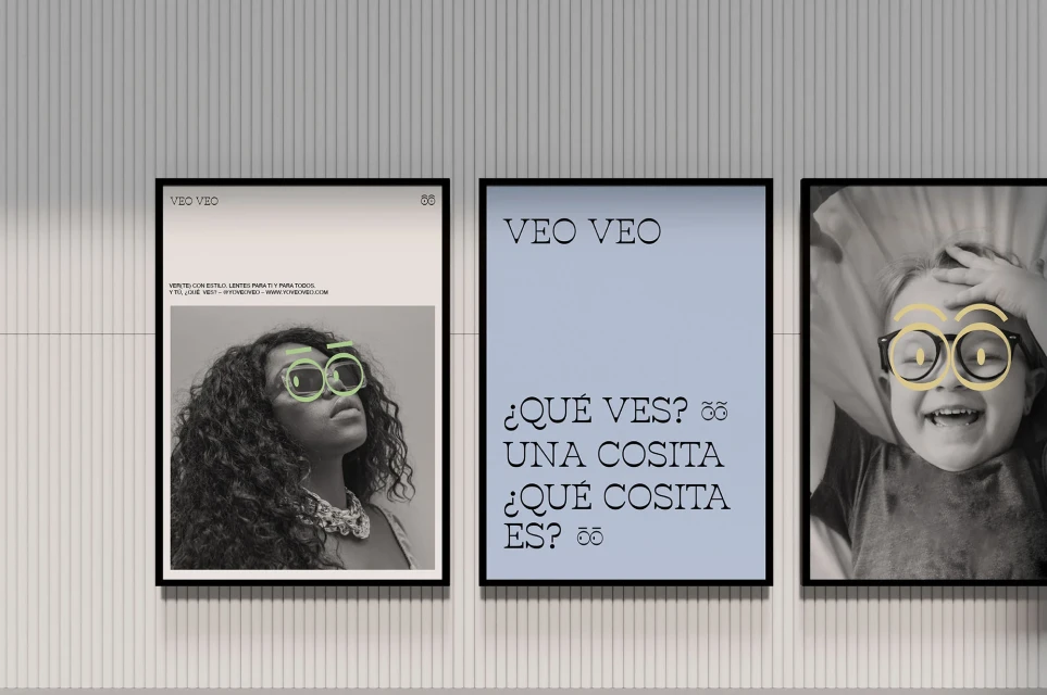 Three framed posters hang on a striped wall. The posters feature photography and typography with sunglasses and eye-wear design elements.