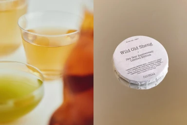 Round tea cake with printed label and two glasses of brewed tea for TeeMaa brand identity project