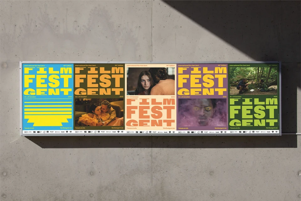 Outdoor posters for the 30th International Film Fest Gent festival with various images and typography on a concrete wall.
