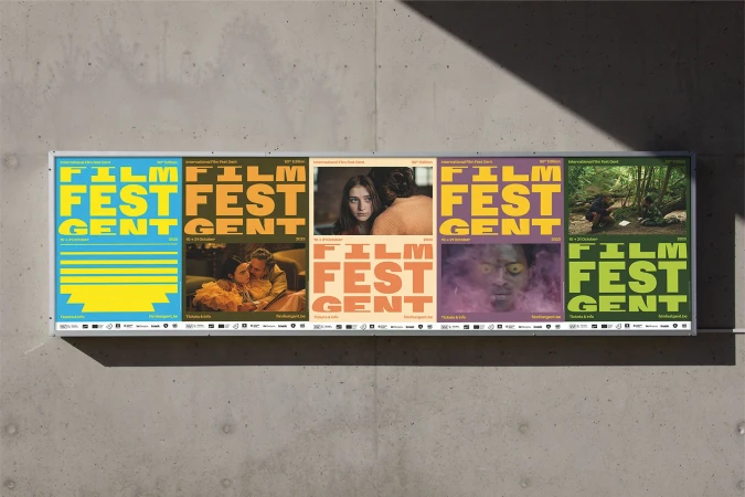 Outdoor posters for the 30th International Film Fest Gent festival with various images and typography on a concrete wall.