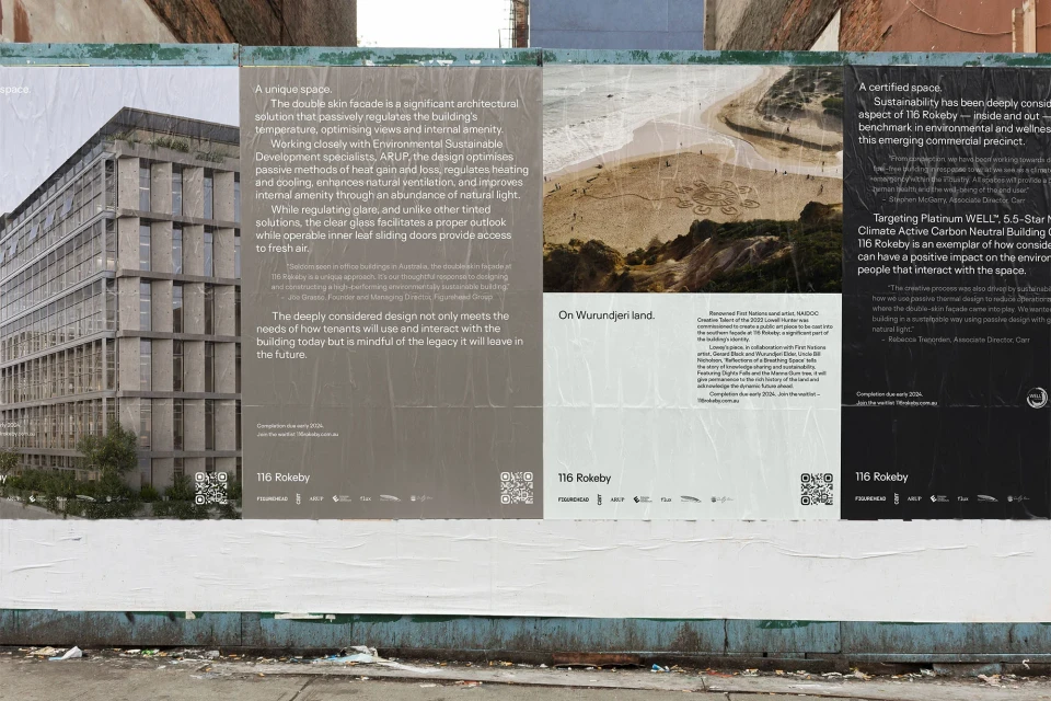 Architectural billboards display building facade and construction details in an urban setting, highlighting sustainable design elements.