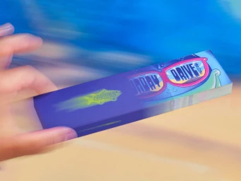 Hand interacting with a custom Cartuna branded flipbook against a blue and beige background.