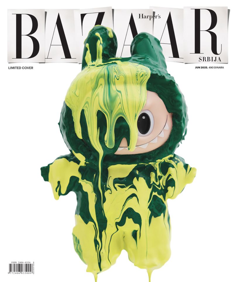 Magazine cover featuring a cartoon-like character figure covered in green and yellow paint against a white background.