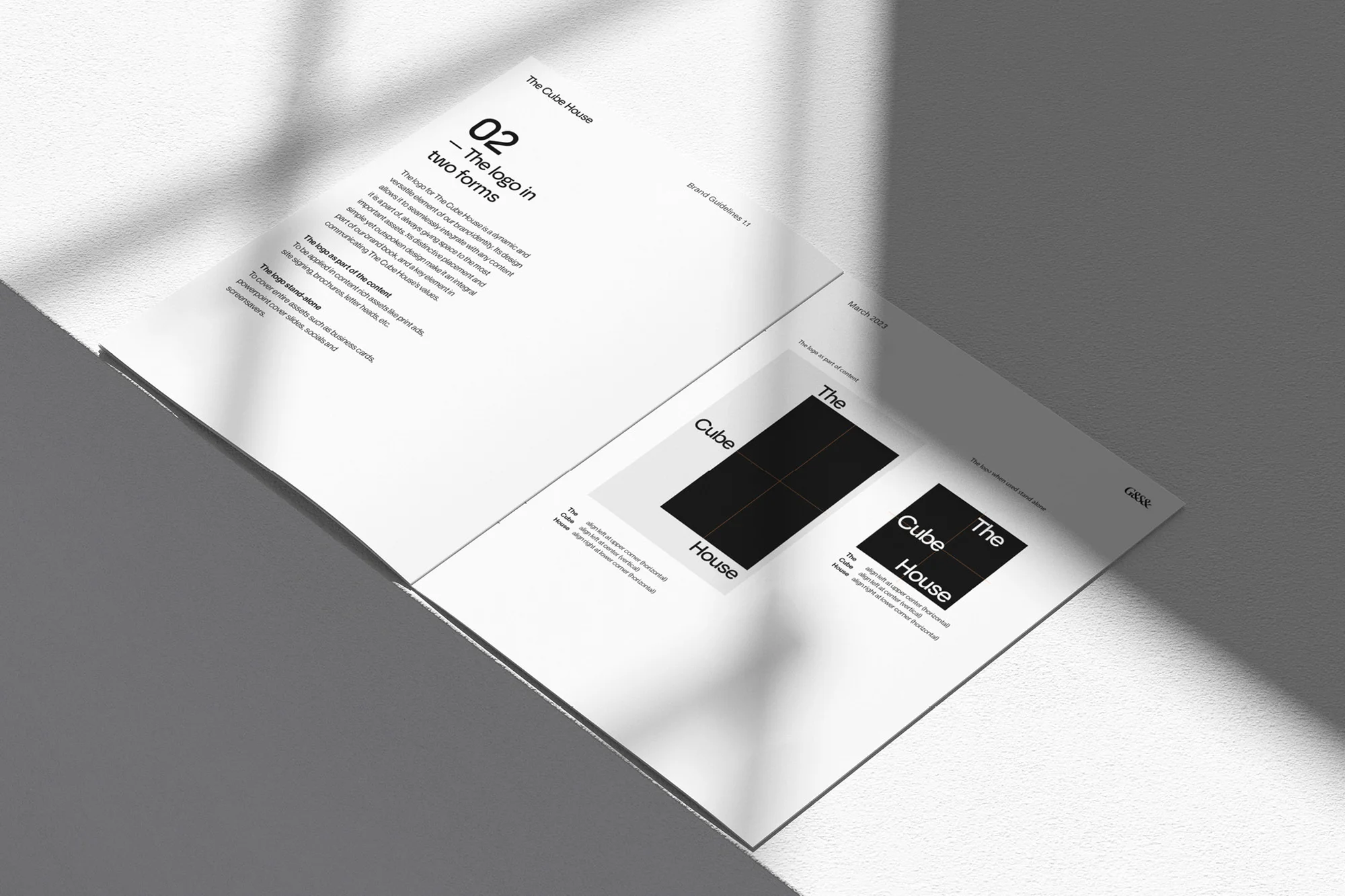 Open brand guidelines document showing logo design for 'The Cube House', featuring a black cube with 'Cube' and 'House' text.