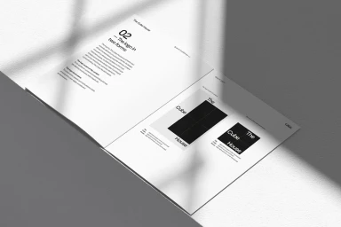 Open brand guidelines document for The CubeHouse showing typography and logo design on white pages under soft shadows.