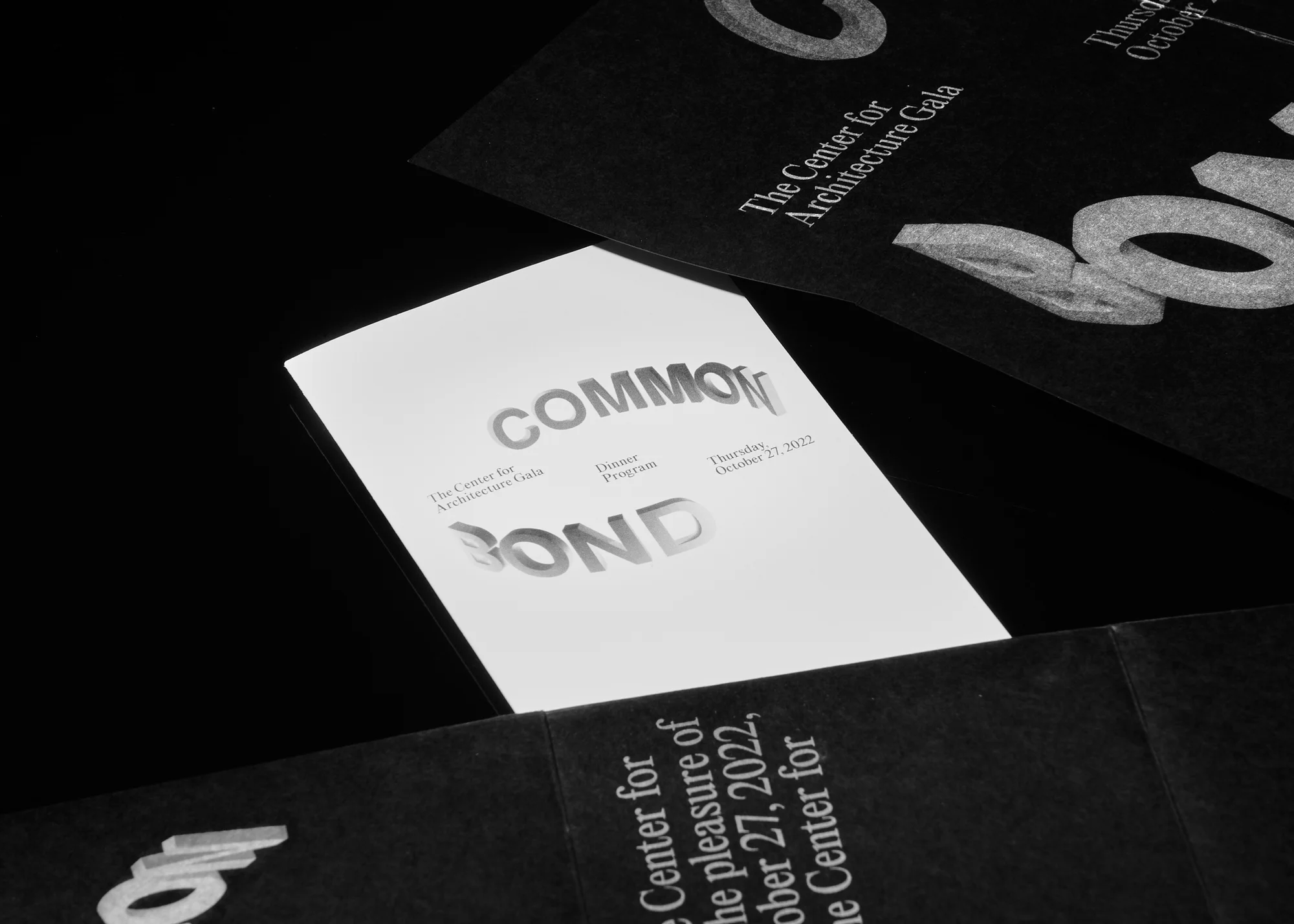 Promotional material for 'The Center for Architecture Gala', showcasing event details and branding on elegant black and white cards.