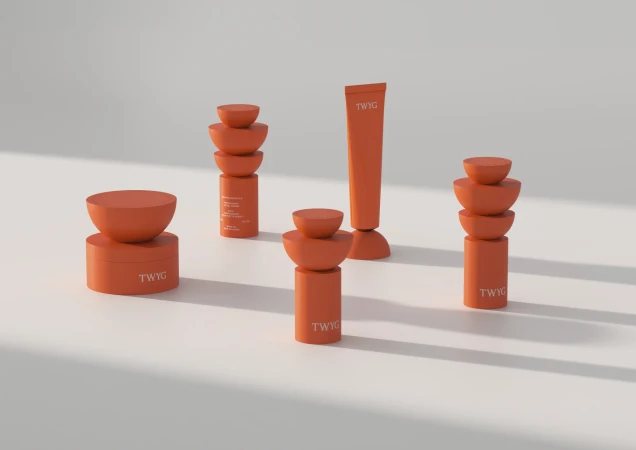 Five orange cosmetic product containers arranged on a light surface with subtle shadows create a minimalist beauty product display.