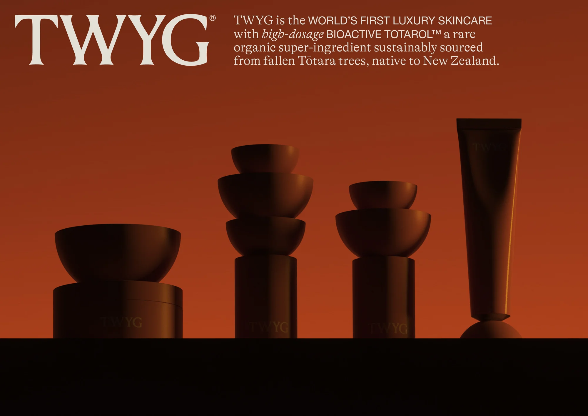 Product photography of TWYG skincare line against a gradient orange background. The composition features stacked bowls and a tube.