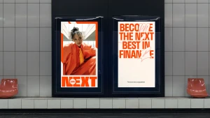 Digital advertising display panels in a tiled subway station featuring YoungCapital NEXT campaign graphics with an orange suit and bold typography