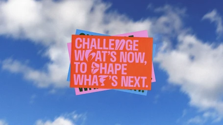 Stacked colorful rectangular cards featuring bold typographic messaging against a bright blue sky with white clouds background.