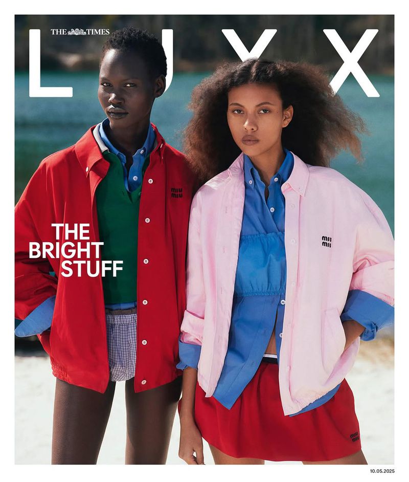 Two fashion models pose in bright Miu Miu jackets on a magazine cover with ocean background, styled in editorial aesthetic.