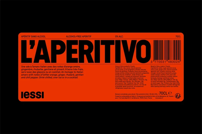 L'Aperitivo label on an orange bottle with black text; the image features the product name, ingredients, and barcode on a black background.