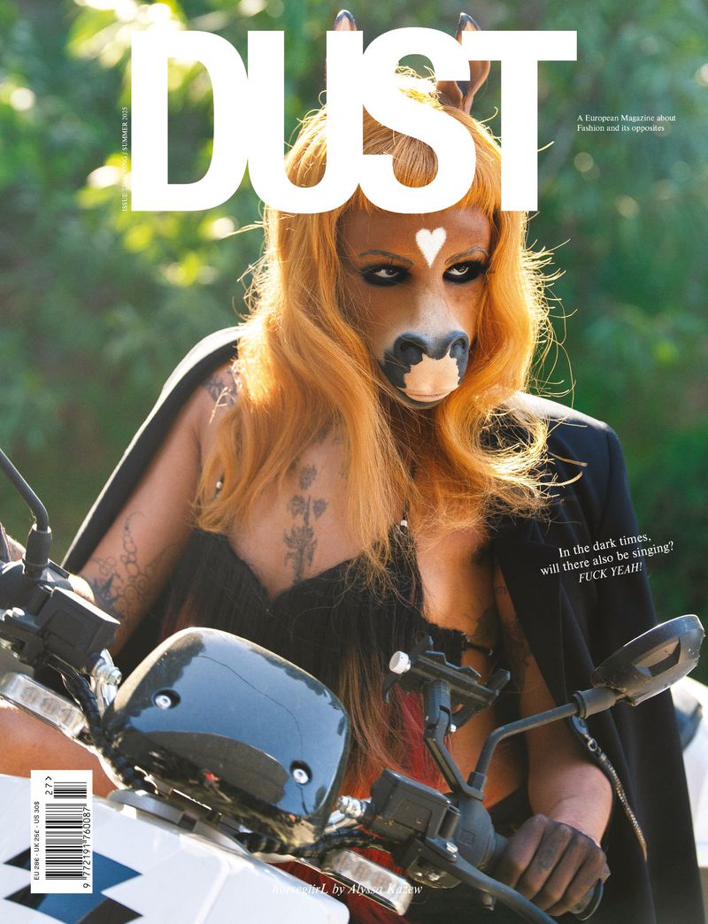 Magazine cover featuring a person wearing a horse mask riding a motorcycle, with the word 'DUST' displayed prominently at the top.