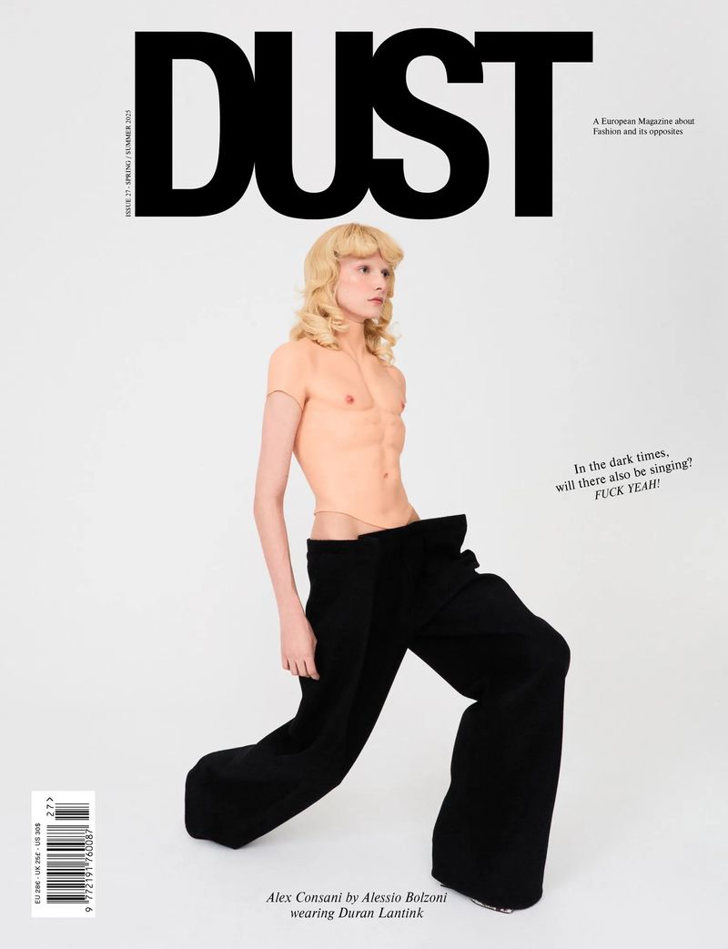 Dust magazine cover featuring a young adult posing in black trousers, styled with blonde hair, against a plain white backdrop.