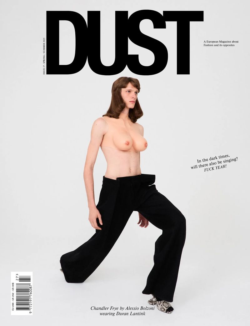 Magazine cover featuring a topless adult female with wide-leg black pants against a white background with 'DUST' in bold text at the top.