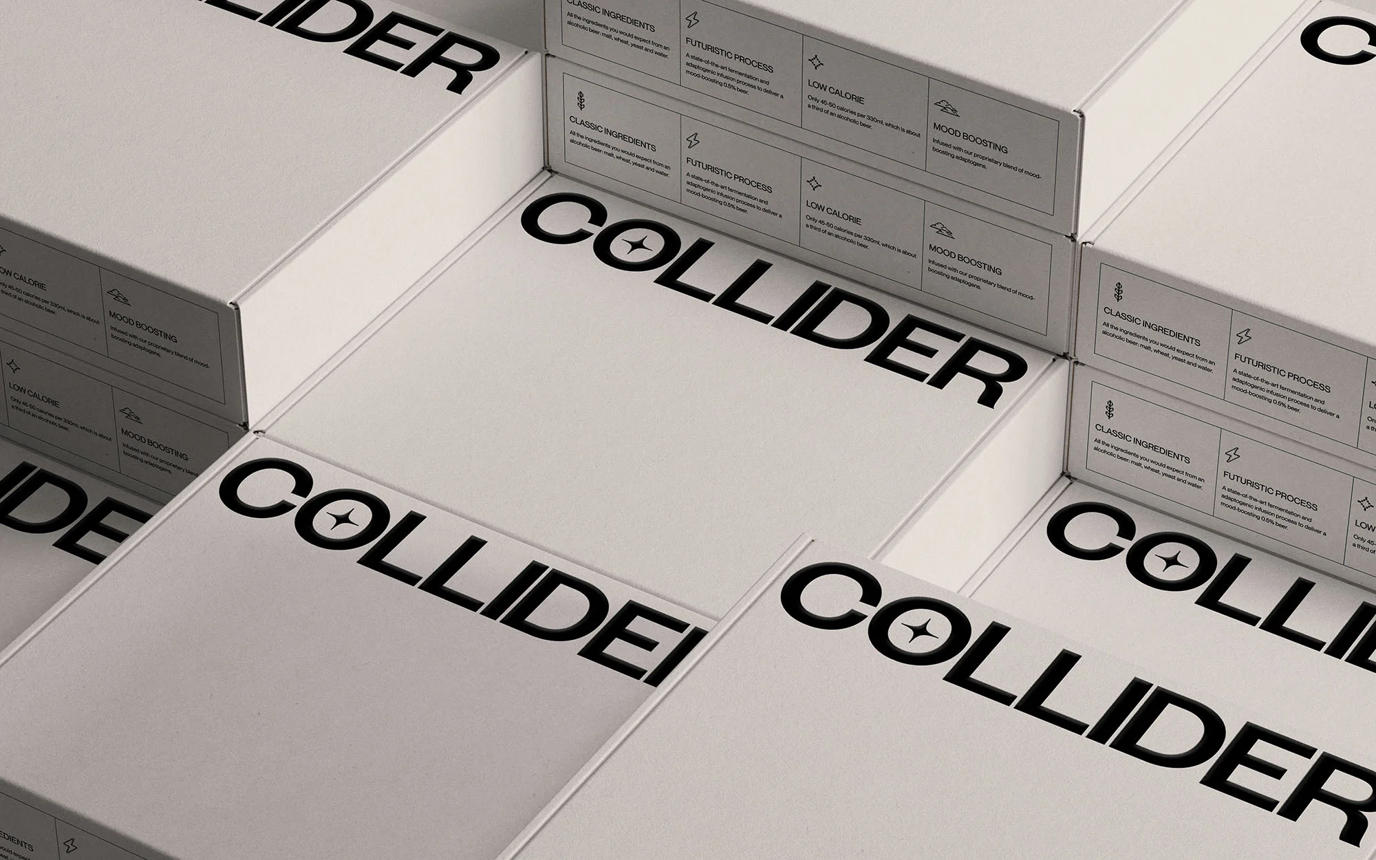 Multiple white product boxes with 'COLLIDER' branding stacked, featuring ingredient and process descriptions on the packaging.