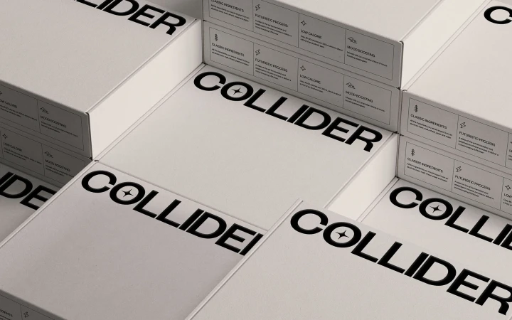Multiple white product boxes with 'COLLIDER' branding stacked, featuring ingredient and process descriptions on the packaging.