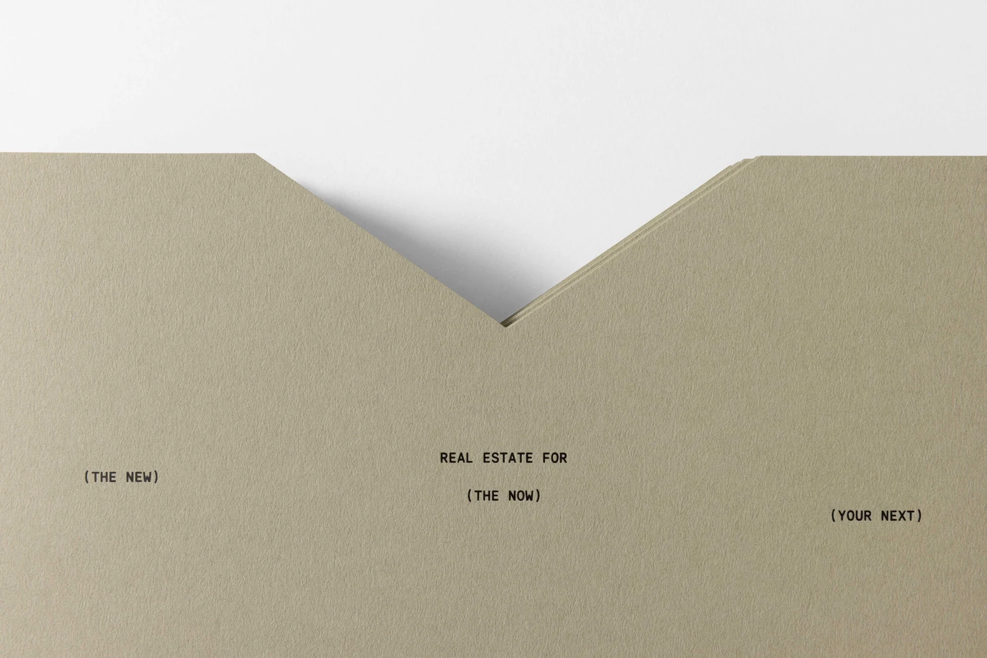 Beige stationery with minimalist text design: Real estate promotion with the phrases (THE NEW), REAL ESTATE FOR (THE NOW), and (YOUR NEXT).