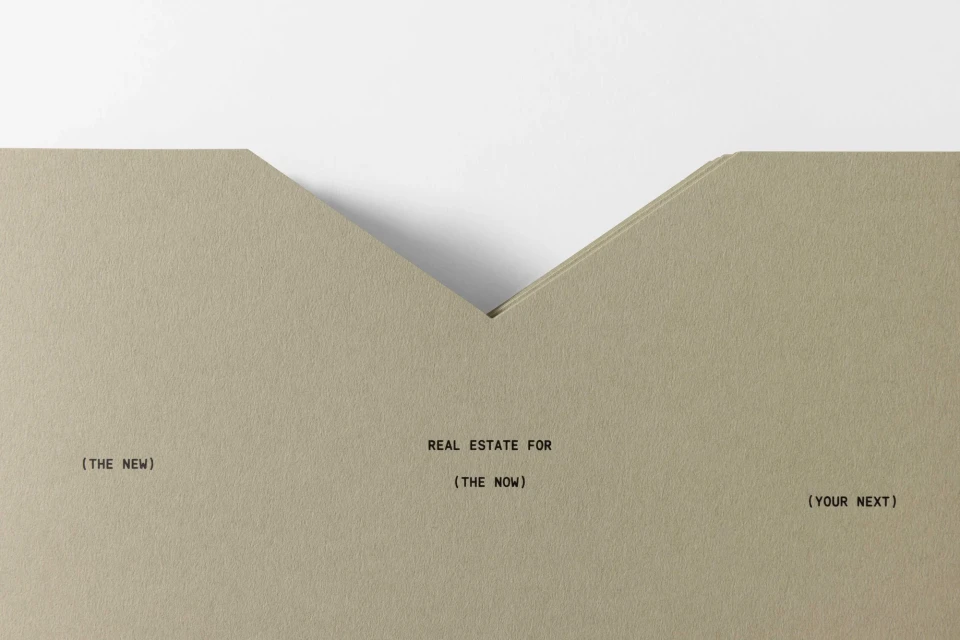 Beige stationery with minimalist text design: Real estate promotion with the phrases (THE NEW), REAL ESTATE FOR (THE NOW), and (YOUR NEXT).