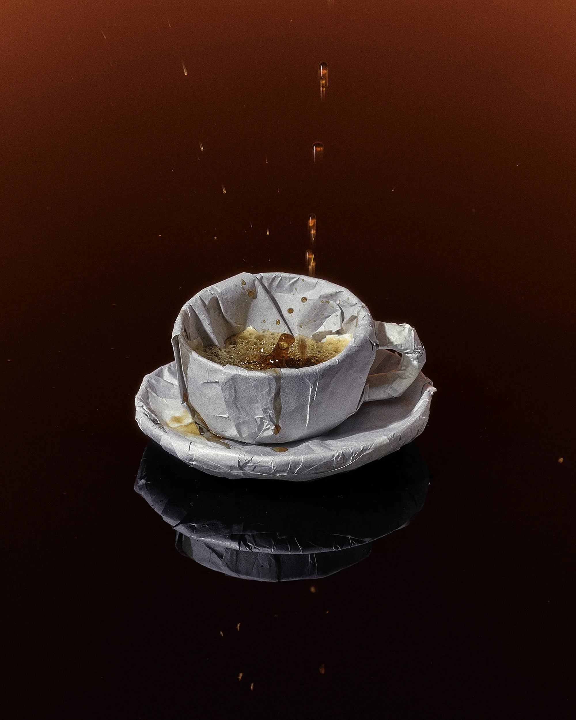 Paper cup and saucer on a black surface with coffee pouring into the cup against a red background, creating a unique visual.