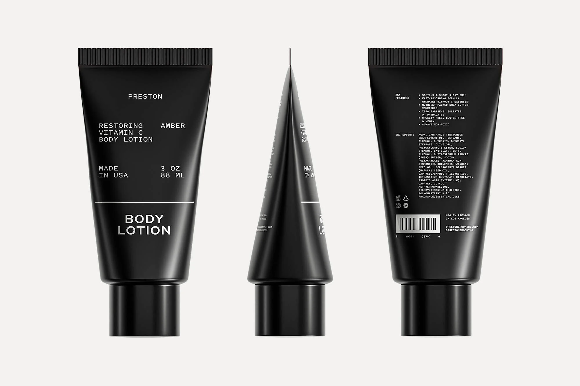 Three black tubes of Preston Restoring Vitamin C Body Lotion. The product label is white font. The background is a neutral off-white.