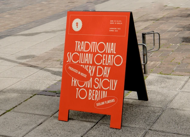Sidewalk A-frame sign advertises traditional Sicilian gelato, freshly made daily in Berlin, with summer launch of Sicilian flavors.