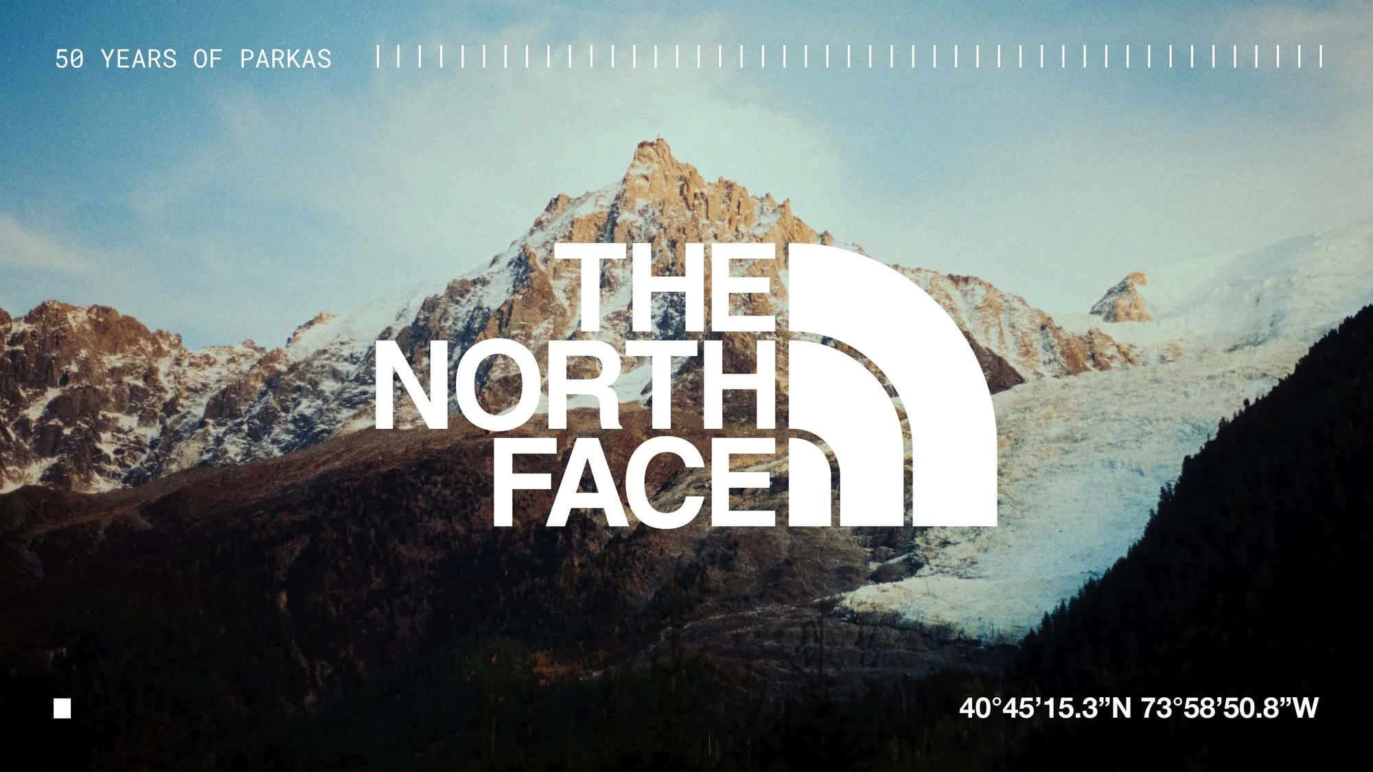 The North Face logo set against a mountain landscape with a glacier, promoting 50 years of parkas and outdoor adventure gear.