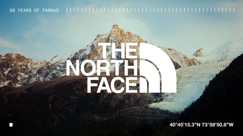 The North Face logo set against a mountain landscape with a glacier, promoting 50 years of parkas and outdoor adventure gear.
