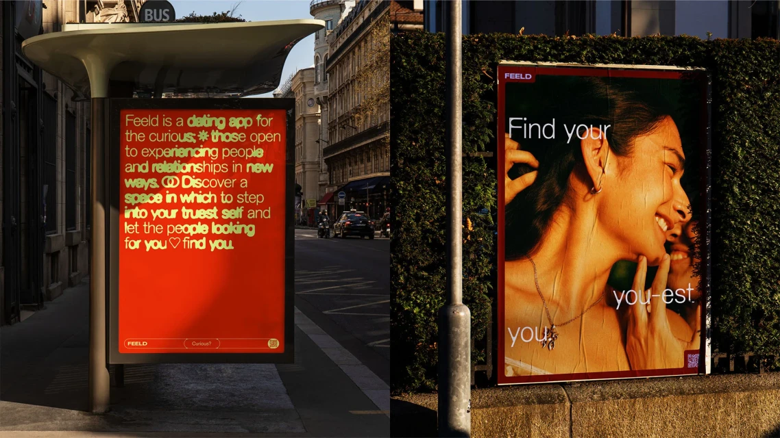 Outdoor advertising featuring a Feeld dating app advertisement with a smiling woman, set against an urban background with buildings and greenery.