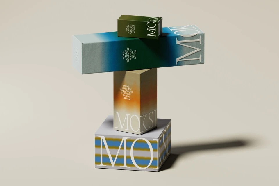Moksi brand skincare product boxes in green, blue, orange, and white stacked on a white background in a studio setting. Beauty concept.