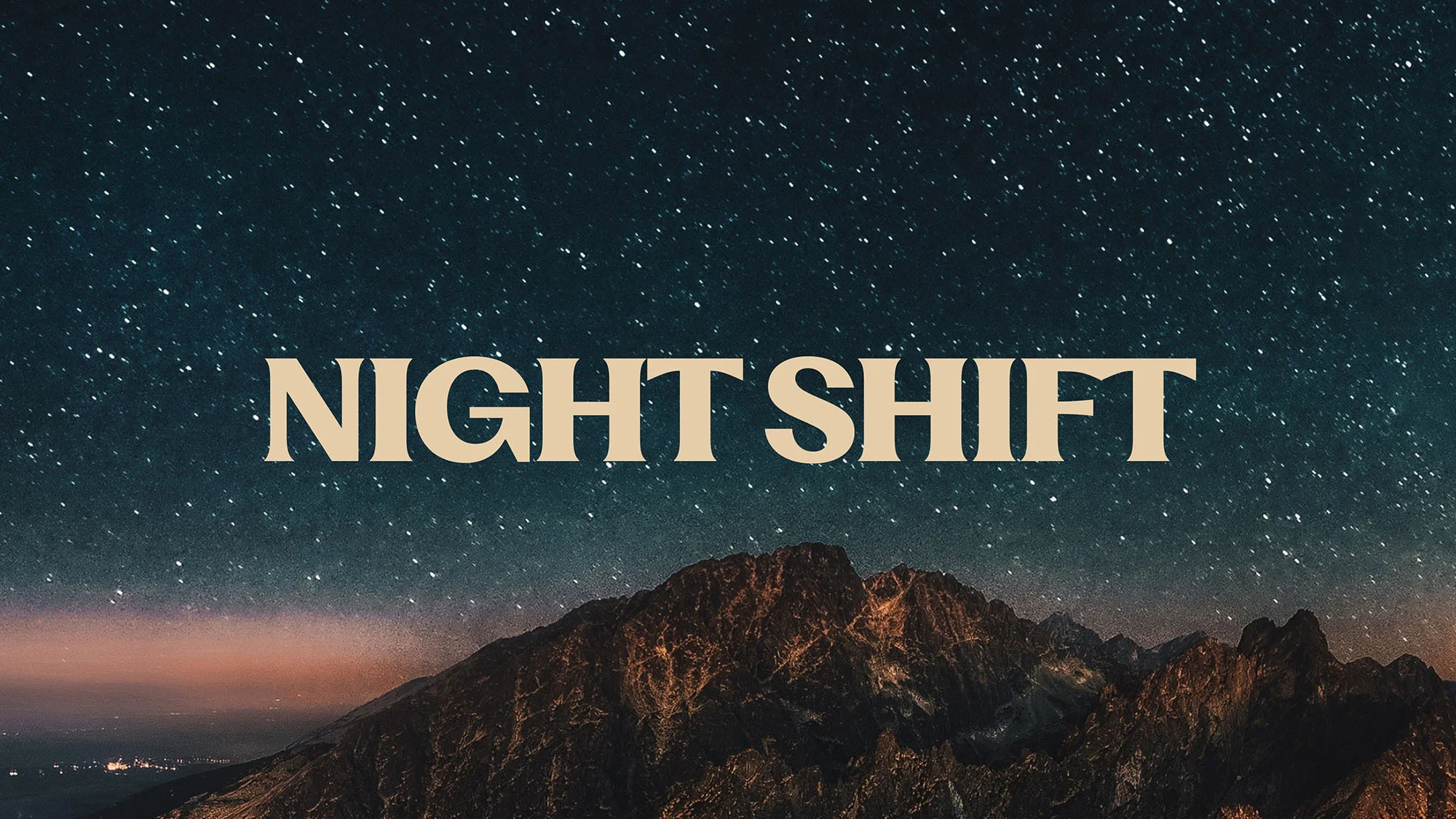 Starry night sky above a dark mountain range with the words NIGHT SHIFT in tan across the middle of the image.