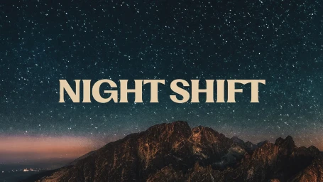 Bold white typography reading NIGHT SHIFT centered over a dark mountain silhouette against a starry night sky